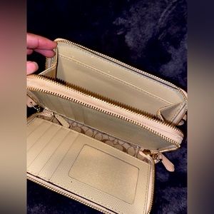 Never used authentic cream colored coach wallet with wristlet attachment :)